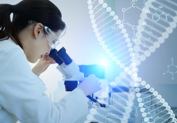Photo of a woman looking at a microscope woth a dna strand on tha background