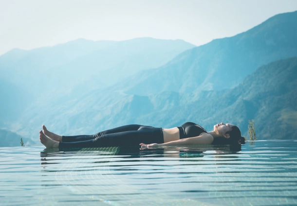 Photo of a woman lying on calm waters